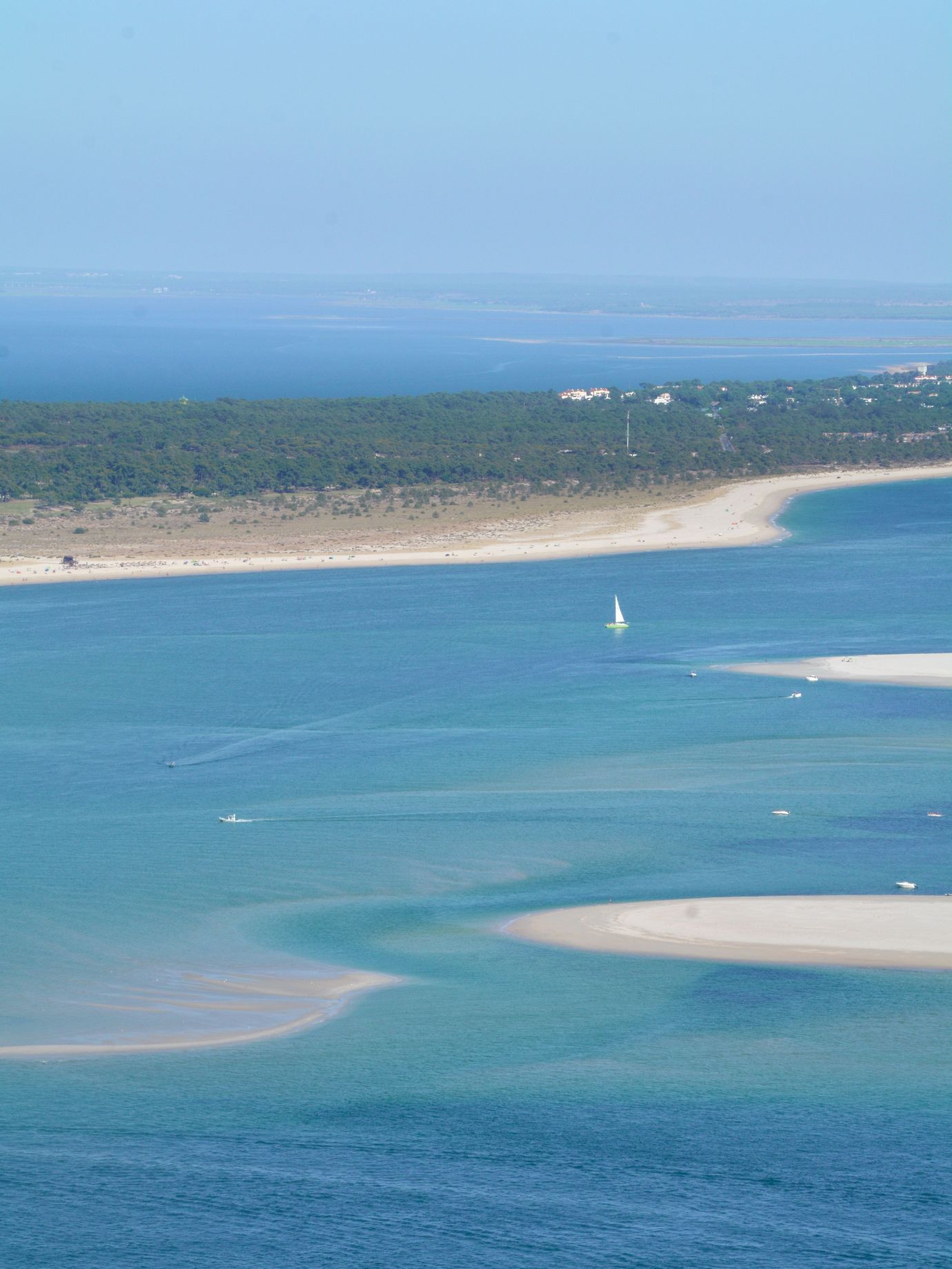Aerial view of turquoise sandbanks and channels along the Arrabida coast near Sesimbra, Setubal, Portugal