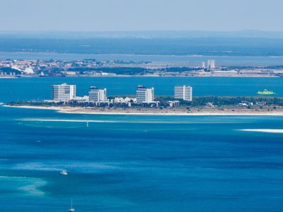Aerial view of Troia peninsula resort, Setubal Aerial view of the Troia peninsula resort towers on a sandy spit with Setubal visible across the estuary, Portugal