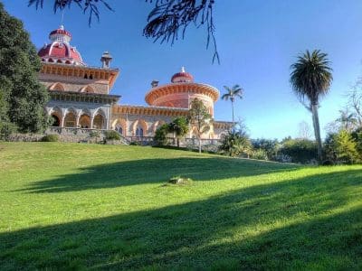 Monserrate Palace domes and gardens near Sintra Monserrate Palace ornate domed towers rising above green lawns and palm trees near Sintra