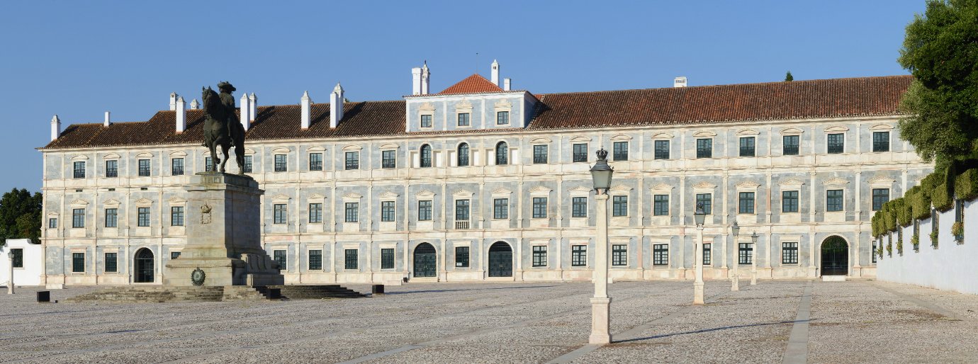Long marble facade of the Paco Ducal, the Ducal Palace of Vila Vicosa in the Alentejo, under a clear blue sky