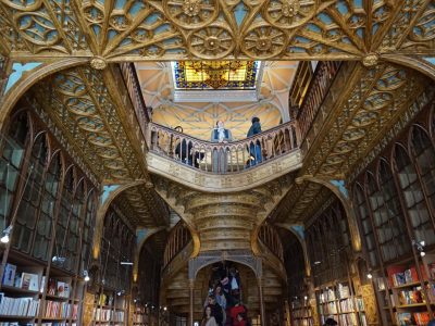 Livraria Lello staircase, Porto Interior of Livraria Lello in Porto showing the red staircase, skylight and bookshelves