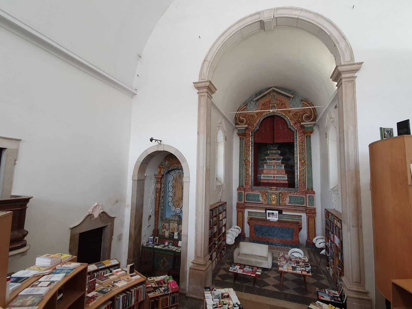 Interior of the 12th-century Igreja de Santiago in Obidos, converted into a bookshop with shelves where the altars once stood