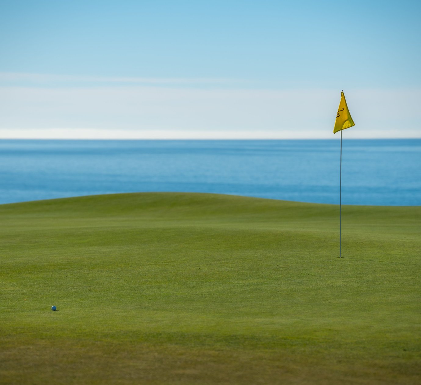 Golf course fairway and green overlooking the ocean near Cascais, Portugal