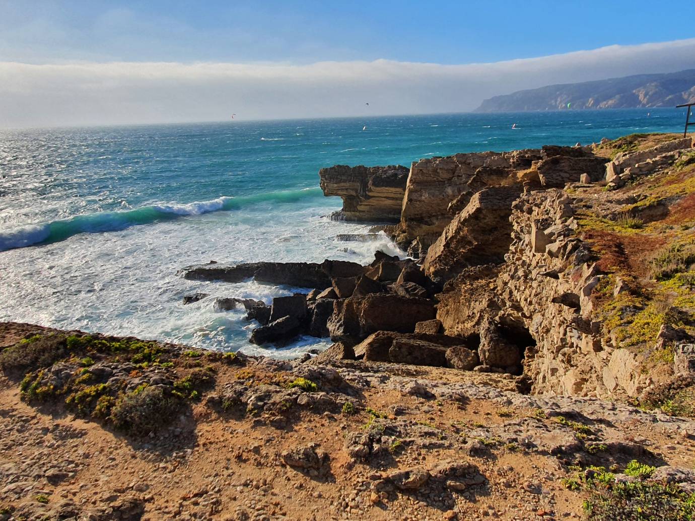 Praia do Guincho beach near Cascais, Portugal, with waves and dunes