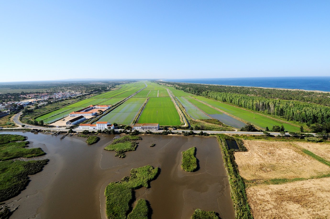 Aerial view of Herdade da Comporta, showing the rice paddies, the Sado estuary and the Atlantic coast, Portugal